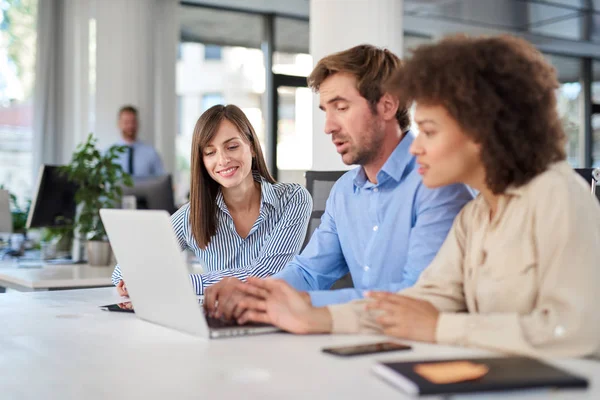 depositphotos_246043736-stock-photo-coworkers-sitting-table-solving-problem