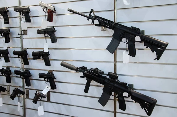 depositphotos_229512594-stock-photo-gun-wall-rack-rifles-pistol