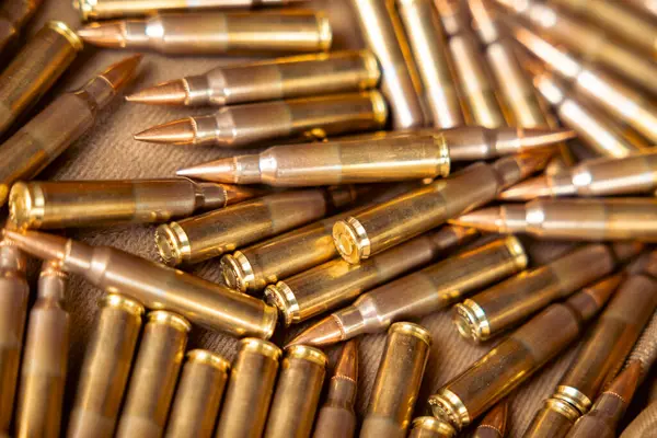 depositphotos_799587952-stock-photo-pile-bullets-copper-tips-warm