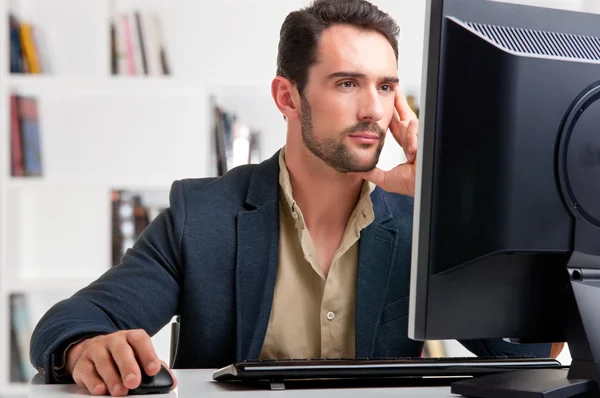 depositphotos_27011949-stock-photo-man-looking-at-a-computer